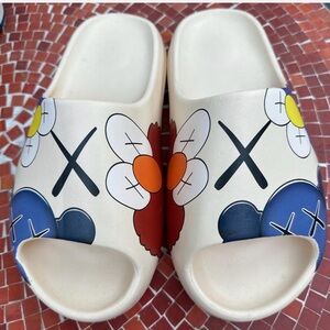 Uniqlo x KAWS Cream and Blue Slippers